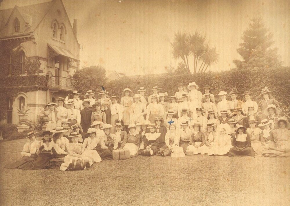 Group of Students and some staff in front gardens, possibly before an outing, 1898-1901