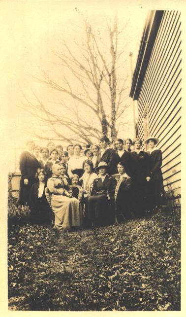 Staff group photographed near School Hospital, 1914