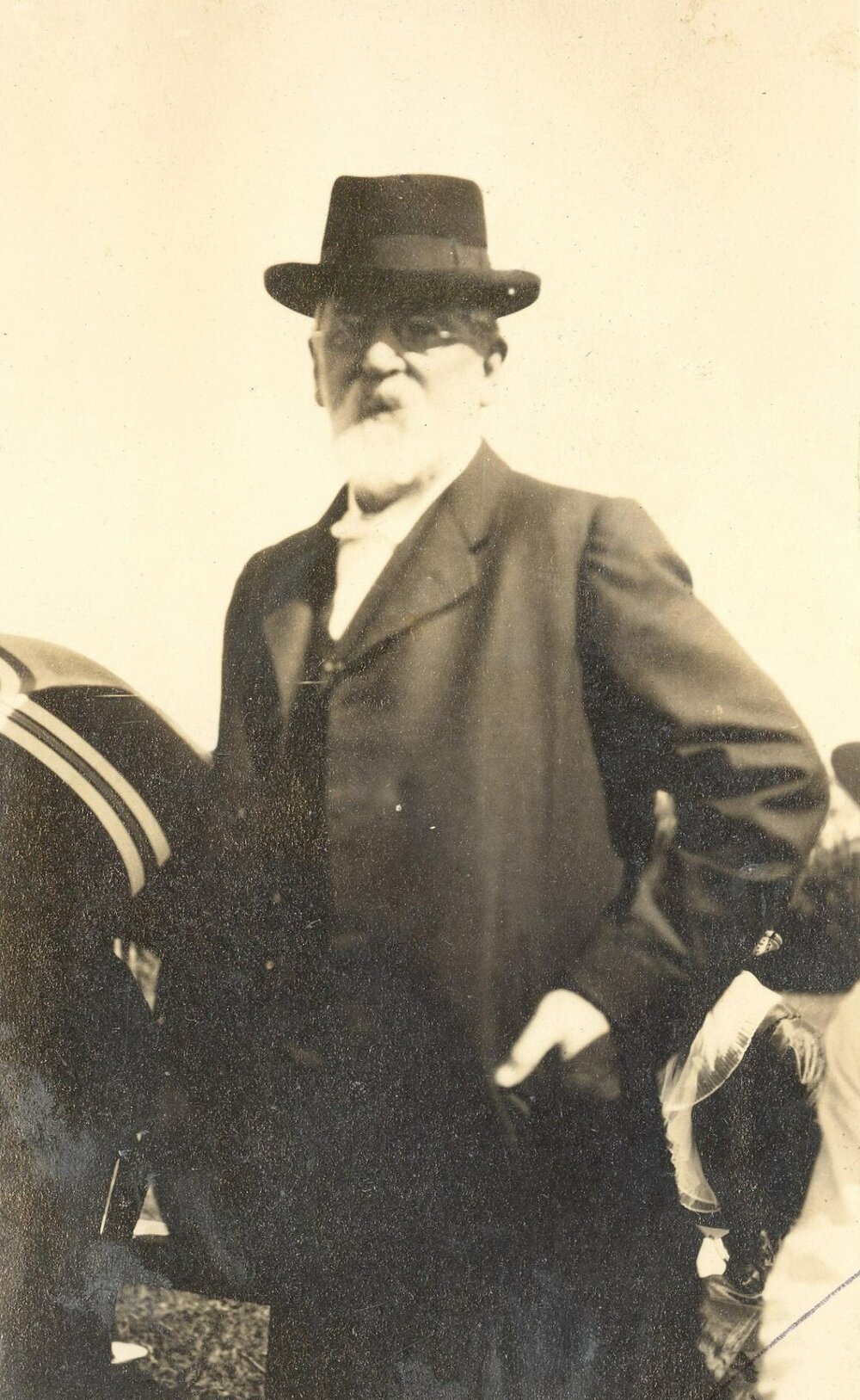 Photo of Rev Dr Fitchett in suit and hat, perhaps at a sports day, c.1914-1917