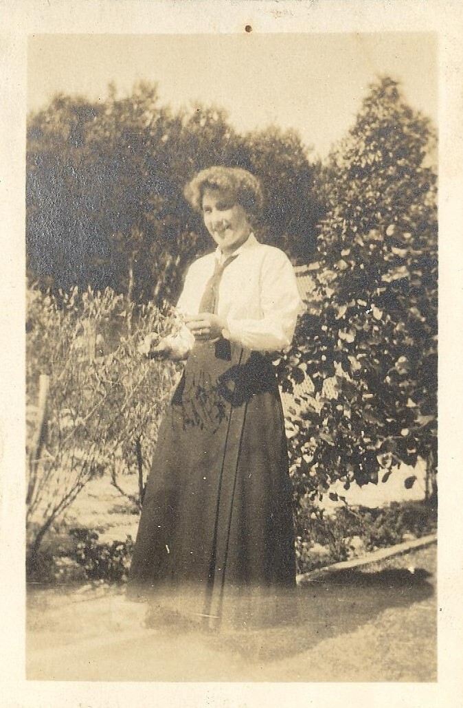 Photo of friend of Winnie Woodmason in uniform in gardens, c.1917
