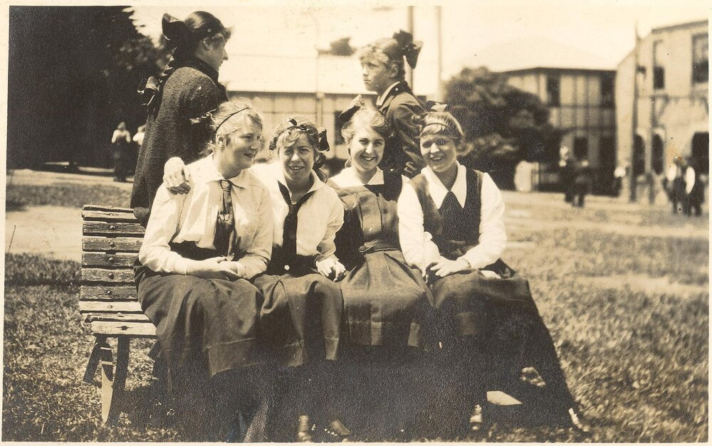 Photo of five SS students on bench in quad area, c.1917 (Woodmason donation)