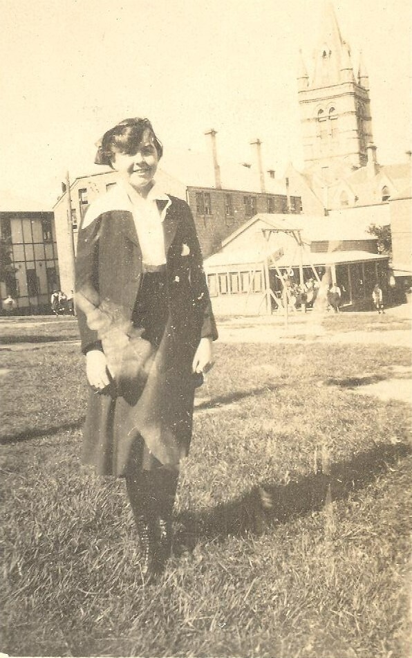Photo of friend of Winnie Woodmason tower in background, c.1917