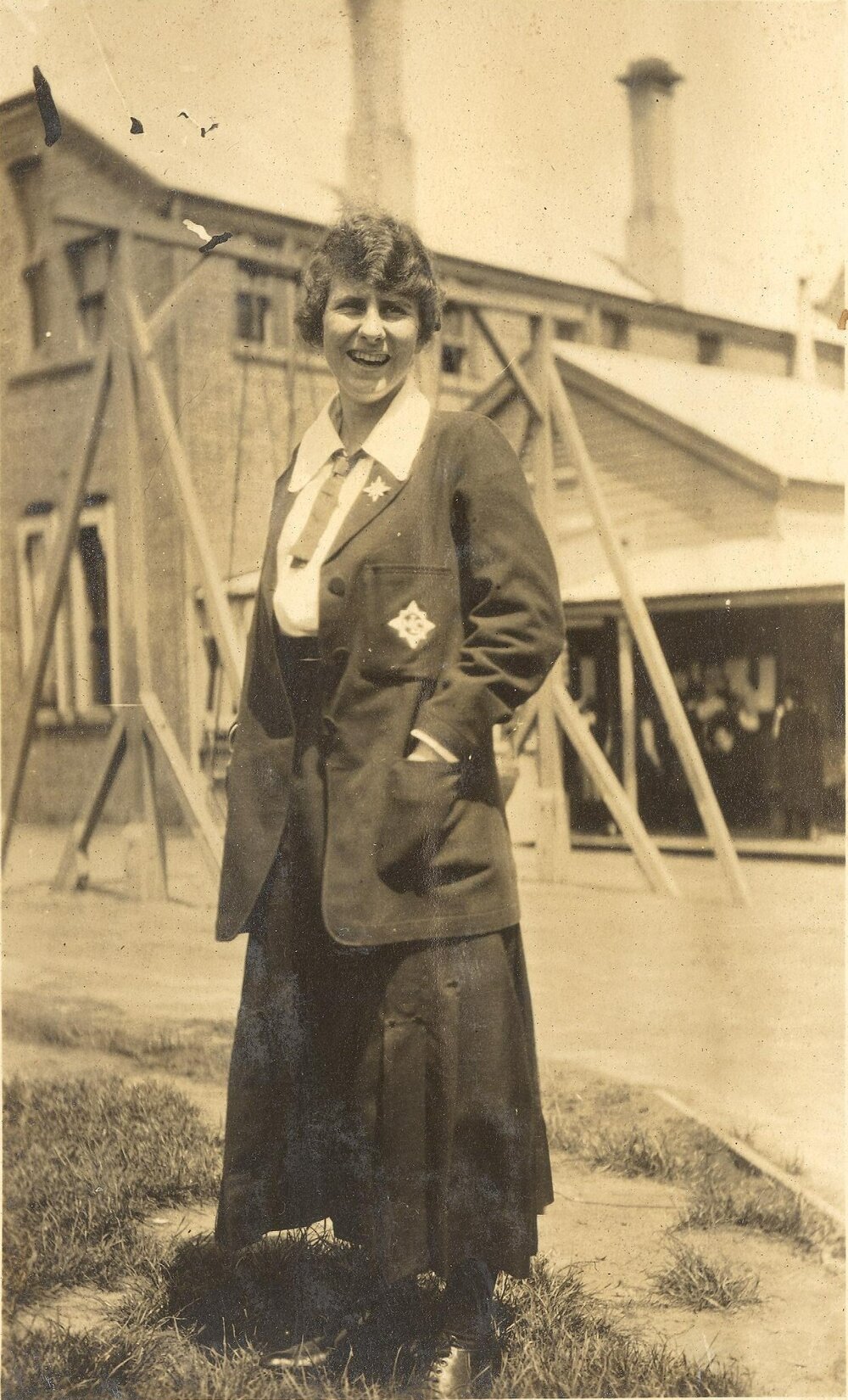 Photo of Winifred Woodmason wearing sports blazer on MLC grounds, c.1917