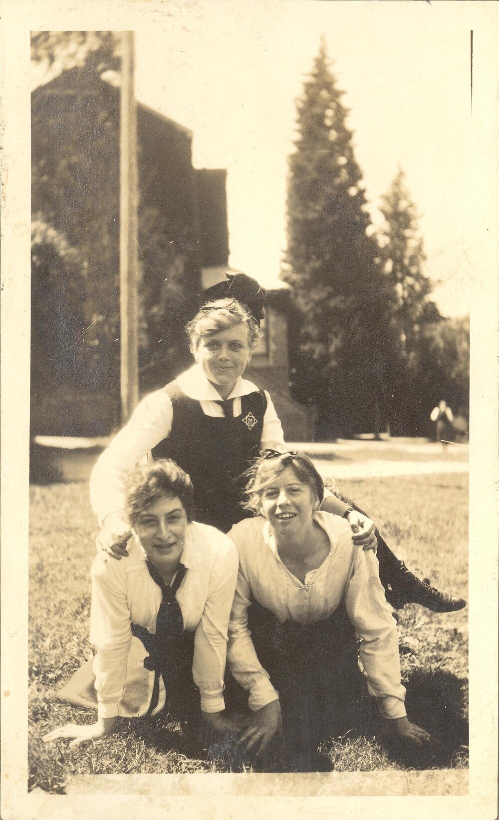 Photo of three students posing on front lawn, c.1917 (Woodmason donation)
