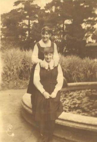 Ina Bitcon and unidentified at fountain, c.1920