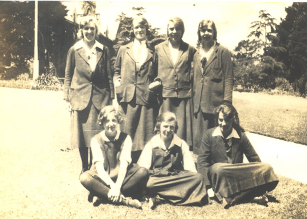 Students in group near flag pole, ca1924, including Alva Phillips