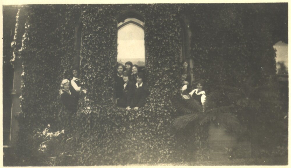 Girls looking out of window of Tiddeman Boarding House c.1924