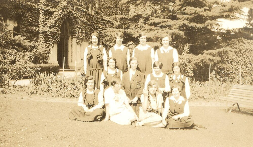 Photo of 12 girls on front lawn, c.1925-26