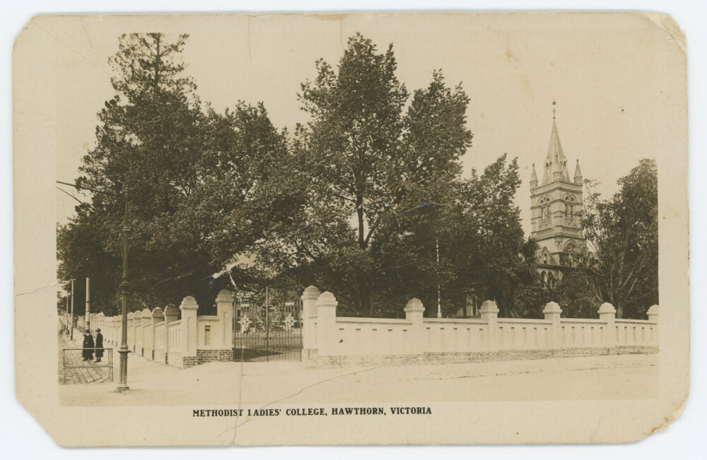 Photographic postcard showing Krome Gates, wall, elms and MLC Tower, c.1926-28.