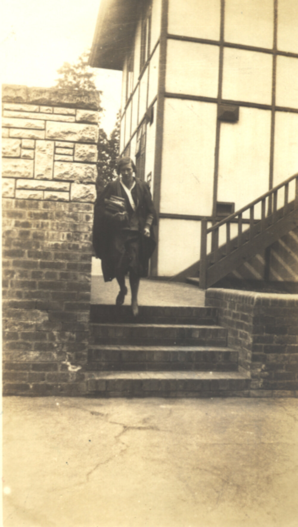 Photo of teacher "Miss Betts coming to Nicholas House for a Latin lesson." c.1932