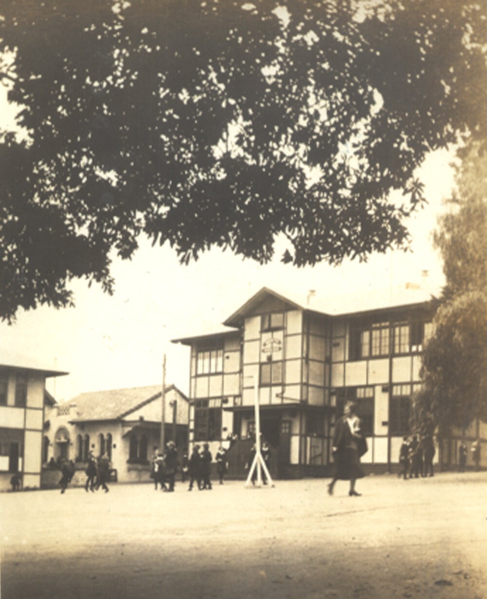 Photo of Miss Betts crossing the Quad, 1932-33