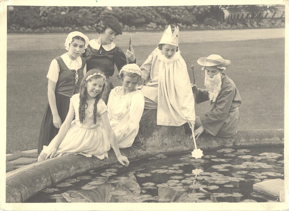 Photo of students, including Noni Rentoul in costume for Shakespeare Day at fountain, 1937