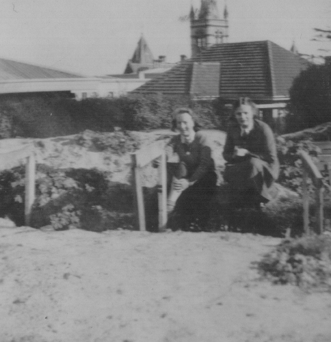 Photo of two students in air raid trenches at MLC, 1940s