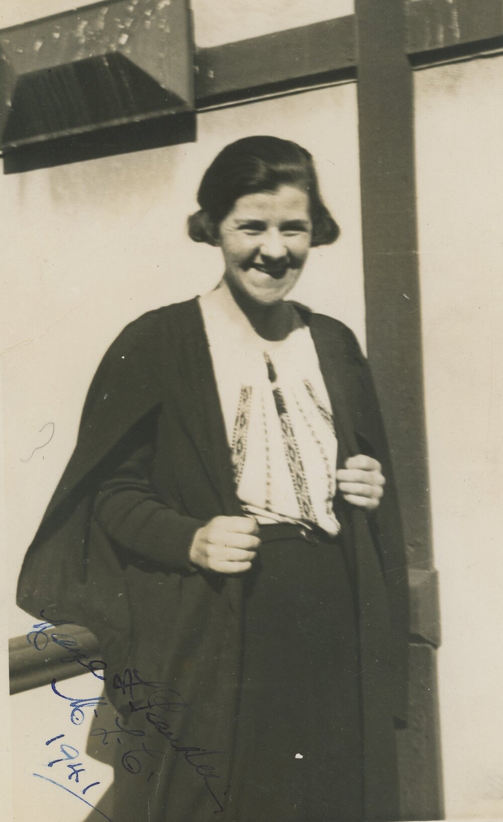 Photo of physics &amp; chemistry teacher Hazel Parker on the MLC Laboratory Steps, 1941