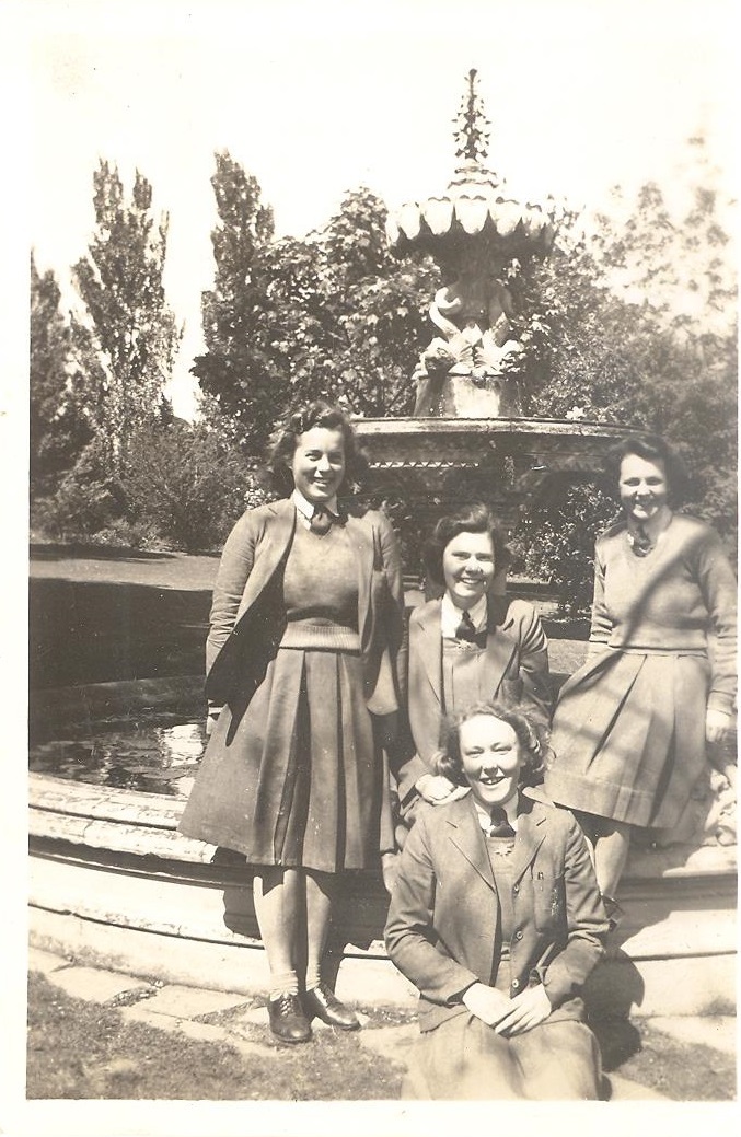 Photograph of Ruth Pretty and three senior school friends by fountain, 1945 (identified)