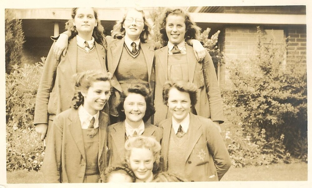 Photo of  Ruth Pretty and six senior school friends, 1945.
