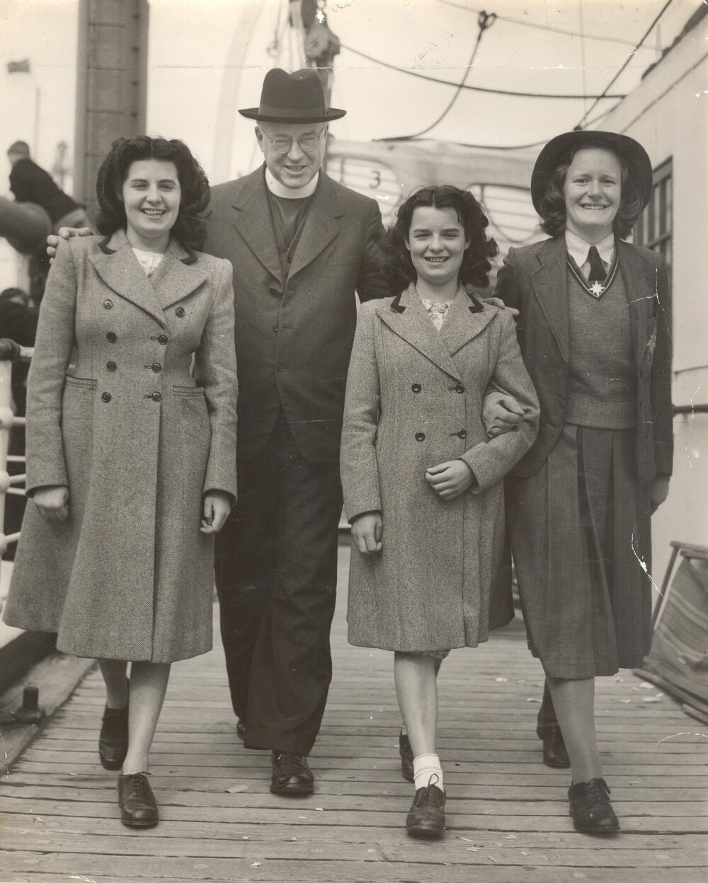 Photo of Dr Wood with UK students Patricia and June Sutton, senior prefect Beverley Ball, 1949
