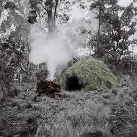 Un-resettling (Dome hut with stone wind break)