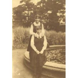 Ina Bitcon and unidentified at fountain, c.1920