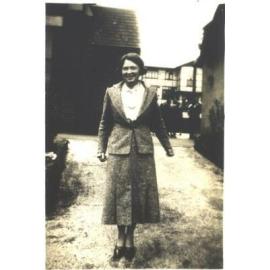 Photograph of teacher, Miss Macdonald, standing in Quad,1886