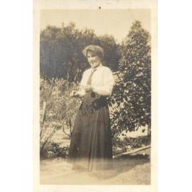 Photo of friend of Winnie Woodmason in uniform in gardens, c.1917