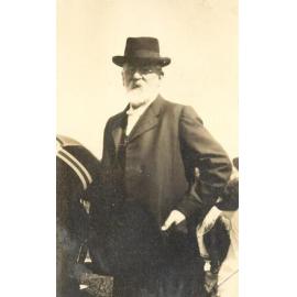 Photo of Rev Dr Fitchett in suit and hat, perhaps at a sports day, c.1914-1917