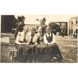 Photo of five SS students on bench in quad area, c.1917 (Woodmason donation)