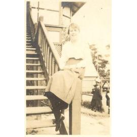Photo of friend of Winnie Woodmason in quad area, c.1917