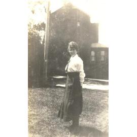 Photo of Winnie Woodmason on lawn, pobably MLC grounds, c.1917