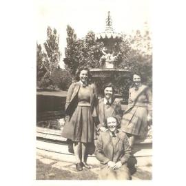 Photograph of Ruth Pretty and three senior school friends by fountain, 1945 (identified)