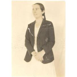 Photograph of Betty Coulson (Allen 1931) in blazer and white Speech Night dress.