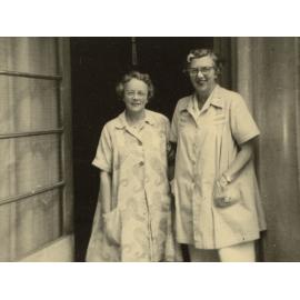 Photo of Betty Lardner and Elsa Tyler, circa 1940s, standing in doorway