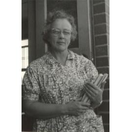Photo of Elsa Tyler holding books, 1940s