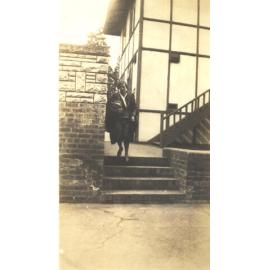 Photo of teacher "Miss Betts coming to Nicholas House for a Latin lesson." c.1932