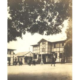 Photo of Miss Betts crossing the Quad, 1932-33
