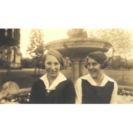 Photo of students Olive Spicer and Jean Carne at fountain, 1932 or 1933