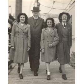 Photo of Dr Wood with UK students Patricia and June Sutton, senior prefect Beverley Ball, 1949